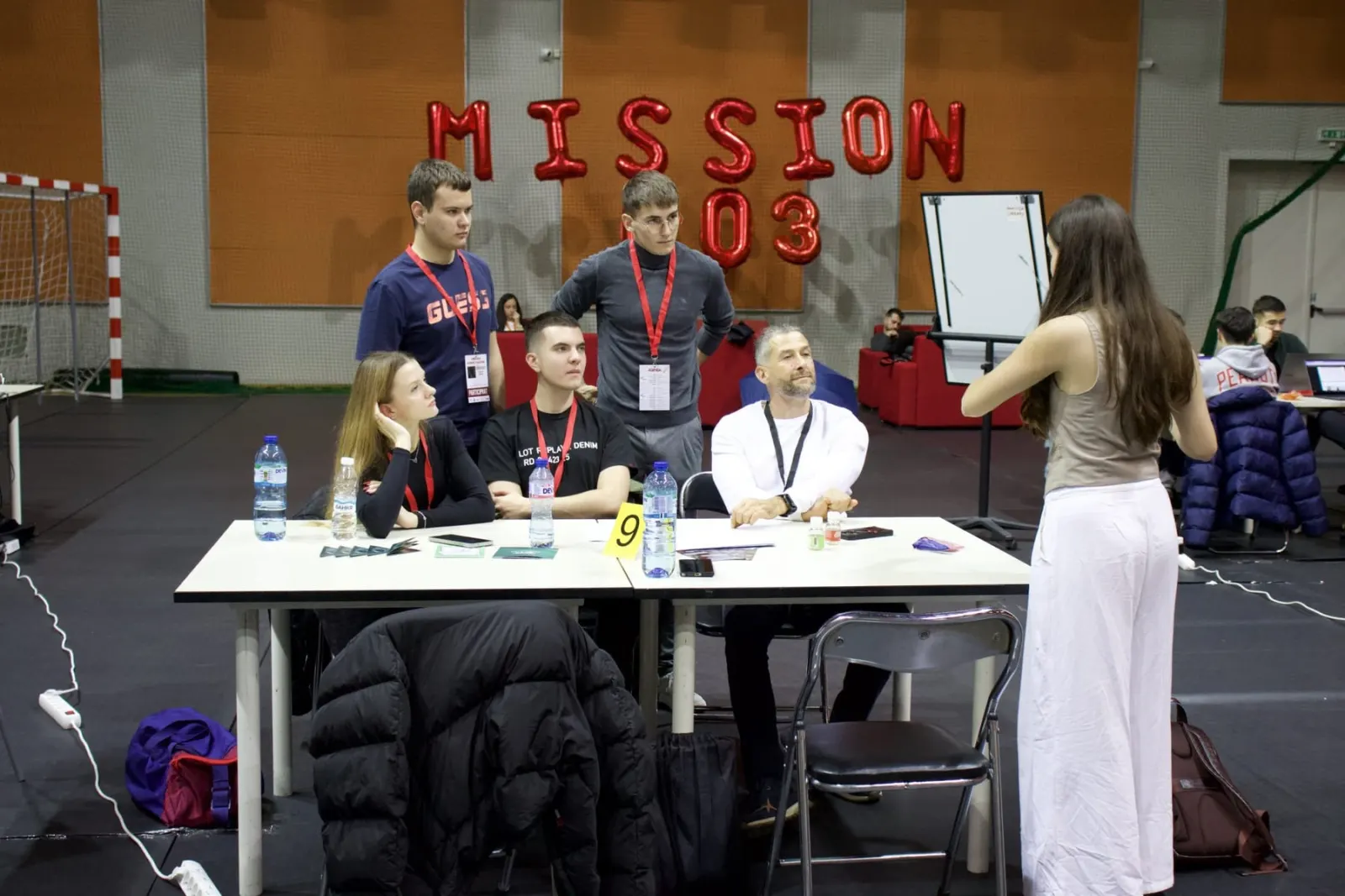 A team presenting to their mentor at Business Challenge 2025